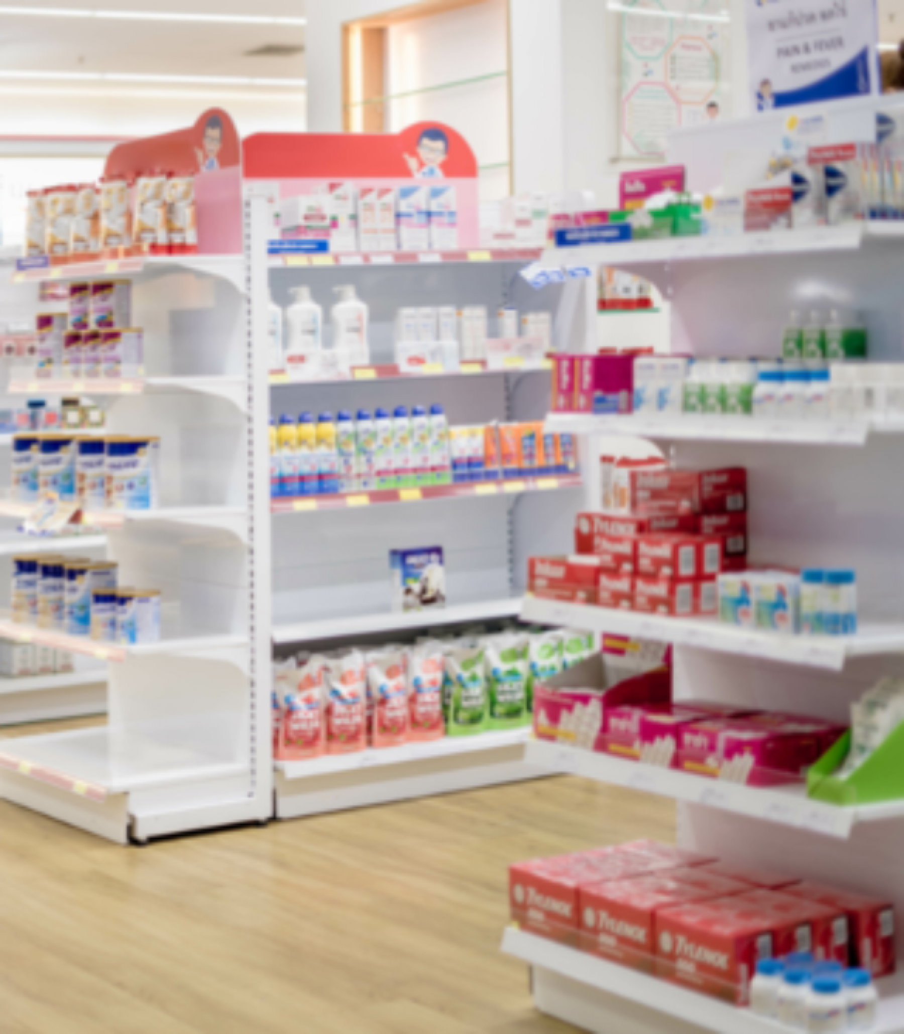 Drugstore shelves lined with over-the-counter medications.